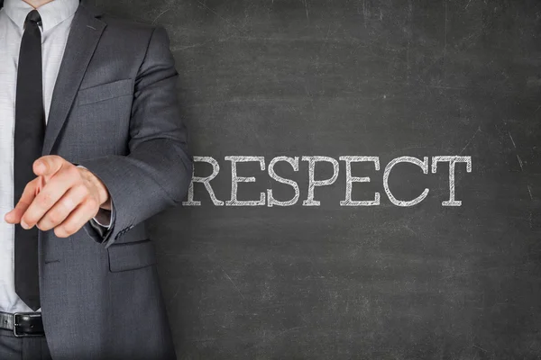 Respect on blackboard with businessman — Stock Photo, Image