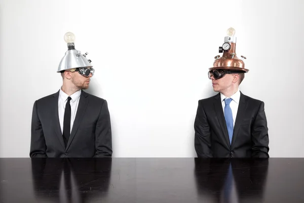 Two businessman sitting at office desk — Stock Photo, Image