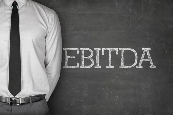 EBITDA tekst op blackboard — Stockfoto