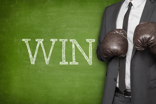 Win on blackboard with businessman on side — Stock Photo, Image
