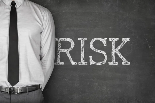 Risk text on blackboard — Stock Photo, Image