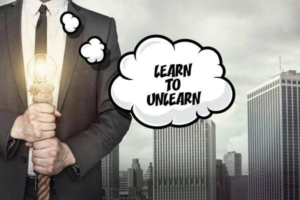 Learn to unlearn text on speech bubble with businessman — Stock Photo, Image