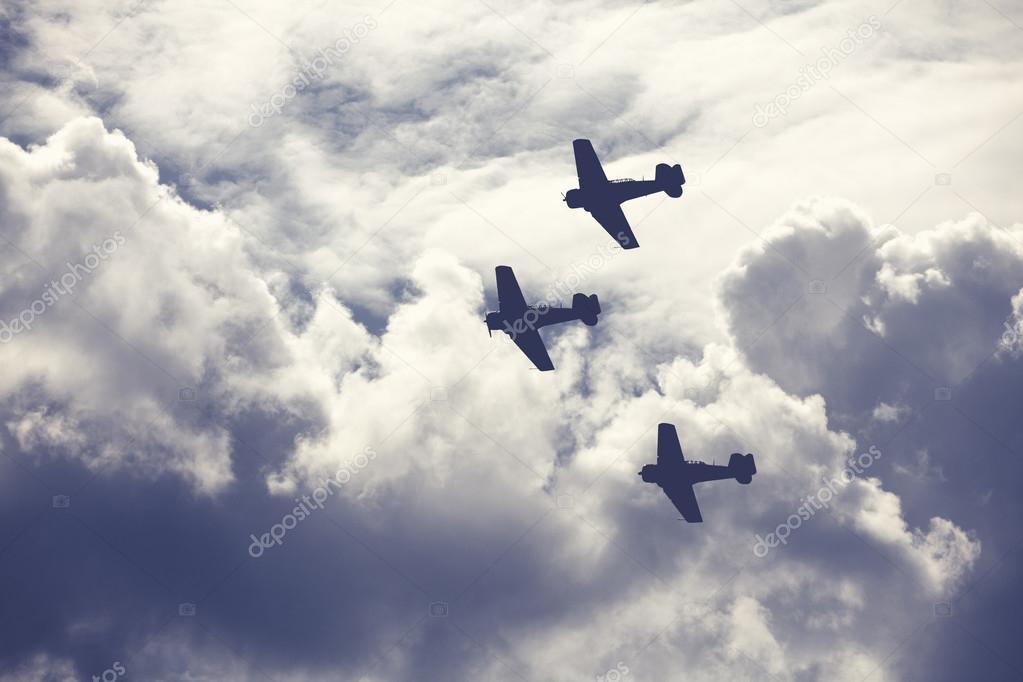 Fighter planes on cloudy sky