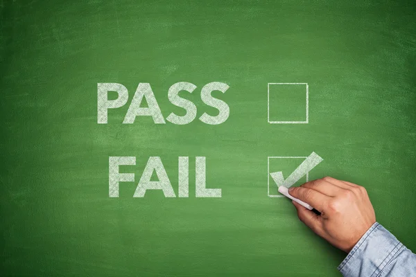 Tick boxes for Pass or Fail on blackboard — Stock Photo, Image