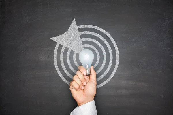 Dartboard on blackboard — Stock Photo, Image