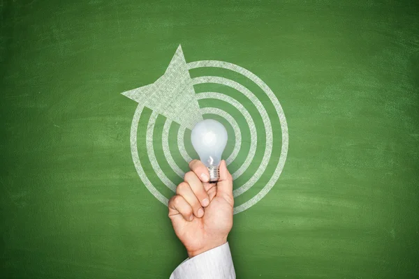 Dartboard on blackboard — Stock Photo, Image