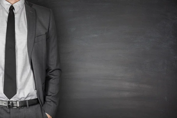 Businessman front of Blackboard — Stock Photo, Image