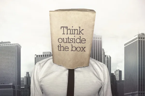 Businessman with a paper bag on head