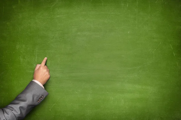 Blank blackboard with businessman hand pointing — Stock Photo, Image