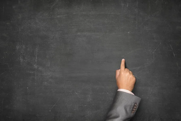 Blank blackboard with businessman hand pointing — Stock Photo, Image