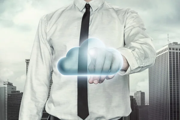 Cloud computing concept with businessman on cityscape background — Stock Photo, Image