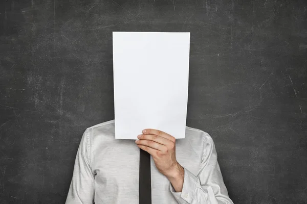 Pusty papier arkusz przodu głowy biznesmen — Zdjęcie stockowe