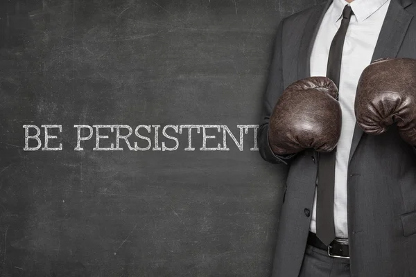 Be persistent on blackboard with businessman — Stock Photo, Image