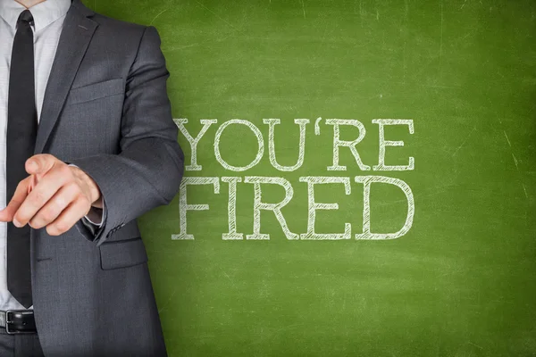 Youre fired on blackboard — Stock Photo, Image