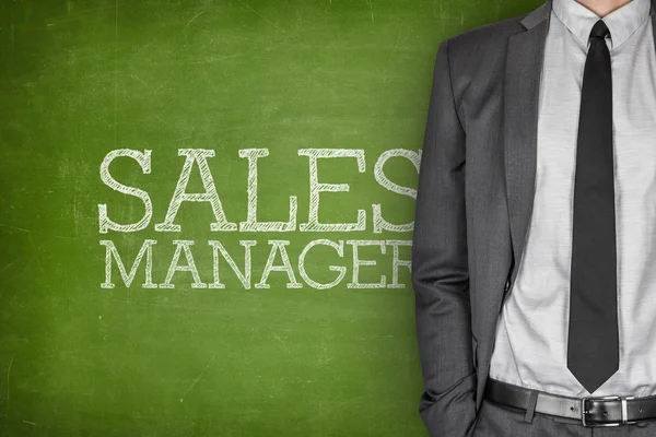 Sales manager on blackboard — Stock Photo, Image