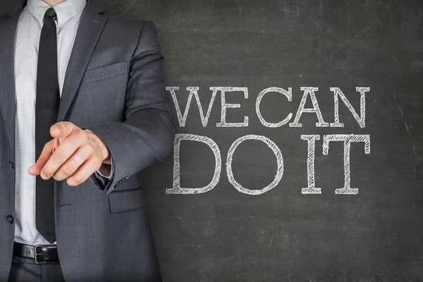 We can do it on blackboard with businessman — Stock Photo, Image