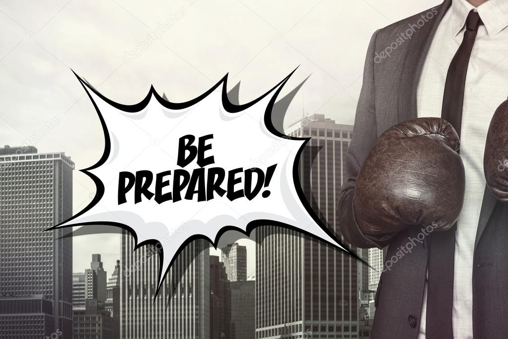 Be prepared text with businessman wearing boxing gloves