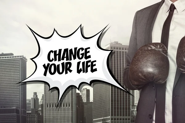 Change your life text with businessman wearing boxing gloves — Stock Photo, Image