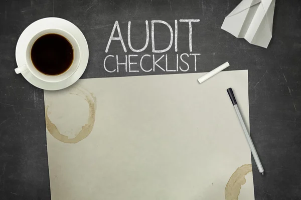 Audit checklist concept on blackboard with empty paper sheet — Stock Photo, Image