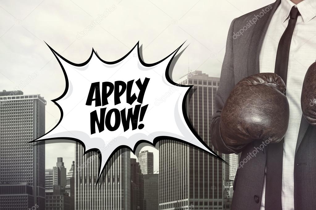 Apply now text with businessman wearing boxing gloves