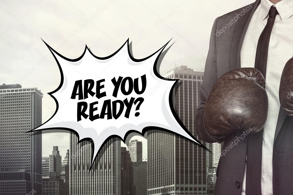 Are you ready text with businessman wearing boxing gloves