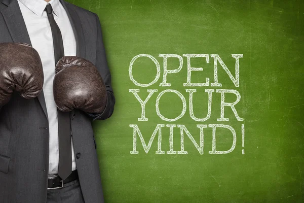 Open your mind on blackboard with businessman on side — Stock Photo, Image
