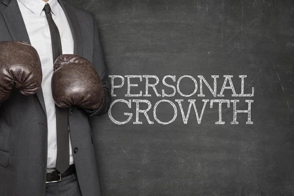 Personal growth on blackboard with businessman on side — Stock Photo, Image