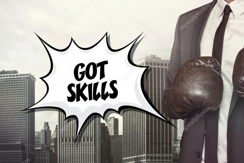 Got skills text with businessman wearing boxing gloves