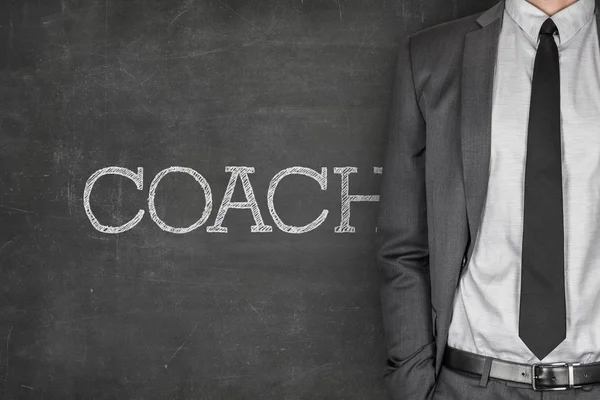 Coach op blackboard — Stockfoto