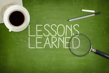Lessons learned concept on green blackboard clipart