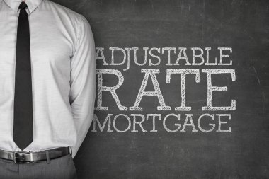 Adjustable rate mortgage text on blackboard clipart