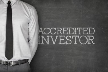 Accredited investor text on blackboard clipart