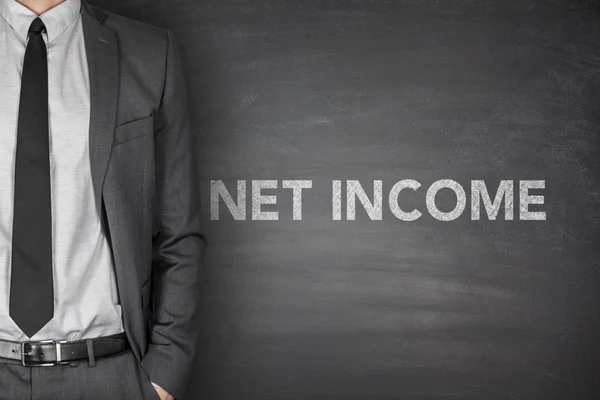 Net income text on black blackboard — Stock Photo, Image