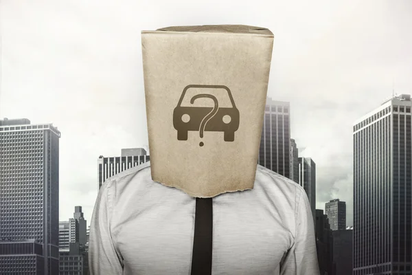 Buy a car concept on brown paper bag which businessman has on head — Stock Photo, Image