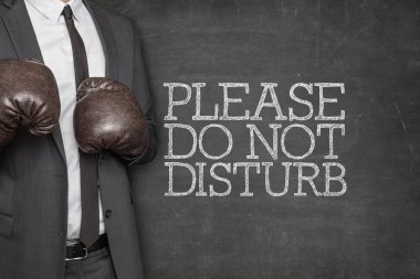 Please do not disturb on blackboard with businessman on side clipart
