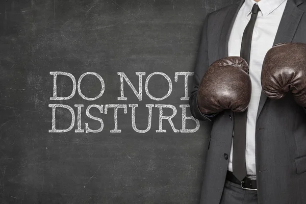 Do not disturb on blackboard with businessman on side — Stock Photo, Image