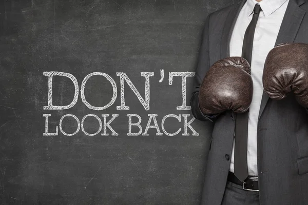 Dont look back on blackboard with businessman on side — Stock Photo, Image