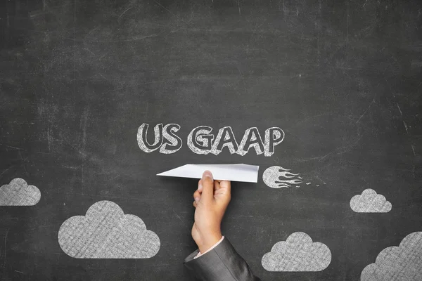 US GAAP concept on blackboard with paper plane — Stock Photo, Image