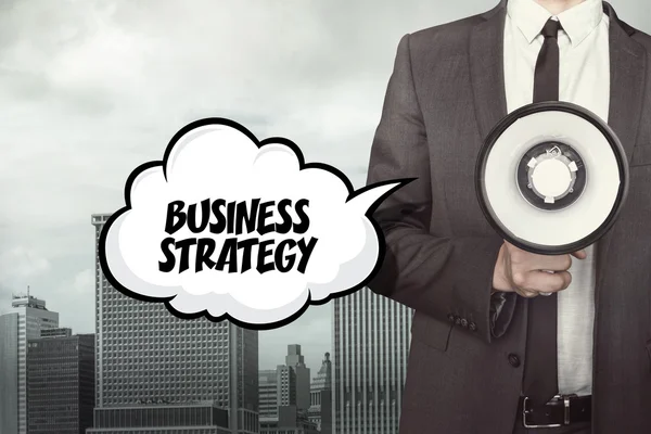 Business strategy text on speech bubble with businessman and megaphone — Stock Photo, Image