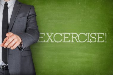 Exercise on blackboard with businessman clipart