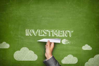 Investment concept on blackboard with paper plane clipart