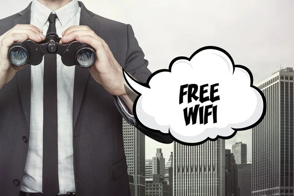 Δωρεάν Wi-Fi κείμενο σε ομιλία φούσκα με επιχειρηματία κρατώντας κιάλια — Φωτογραφία Αρχείου