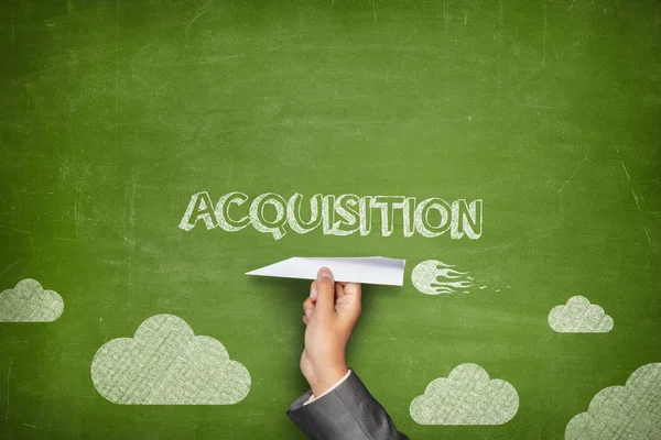 Acquisition concept on blackboard with paper plane — Stock Photo, Image