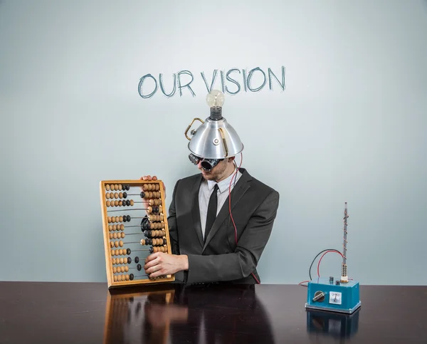 Nosso conceito de visão com empresário vintage e calculadora — Fotografia de Stock