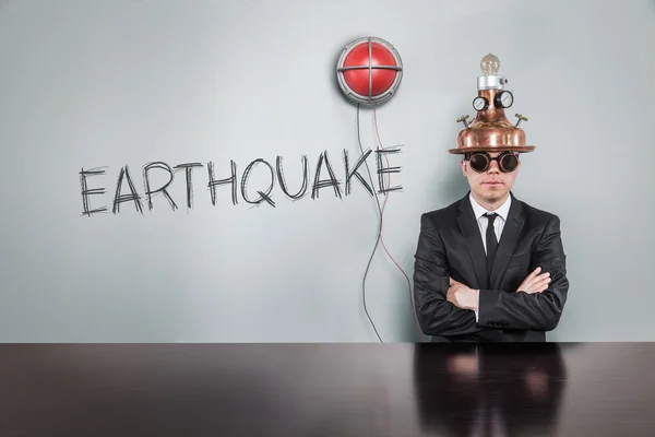 Earthquake text with alert light and vintage businessman — Stock Photo, Image