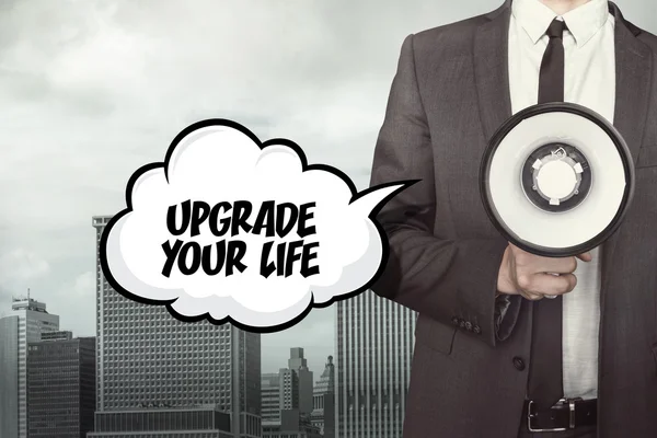 Upgrade your life text on speech bubble with businessman and megaphone — Stock Photo, Image