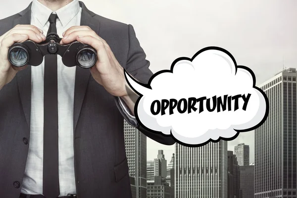 Opportunity text on speech bubble with businessman holding binoculars — Stock Photo, Image