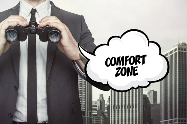 Comfort zone text on speech bubble with businessman holding binoculars — Stock Photo, Image