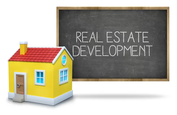 Real estate development on blackboard — Stock Photo, Image