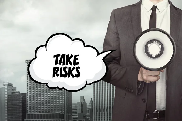 Take risks text on speech bubble with businessman and megaphone — Stock Photo, Image